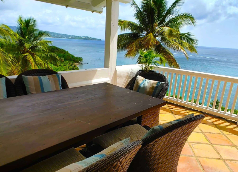 St. Lucia Real Estate Windjammer Landing 2 Bed Villa outdoor dining area overlooking a scenic view of the ocean