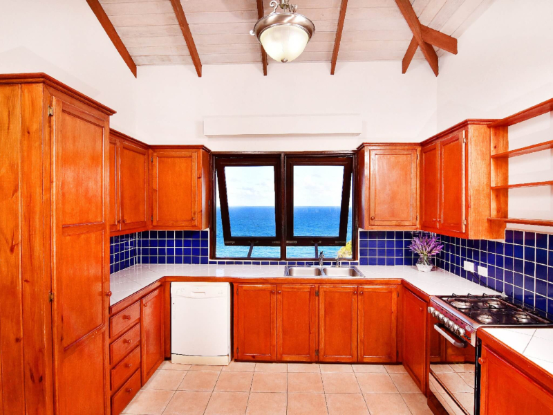 St. Lucia Real Estate Cliffside Estate kitchen with ocean view and stove